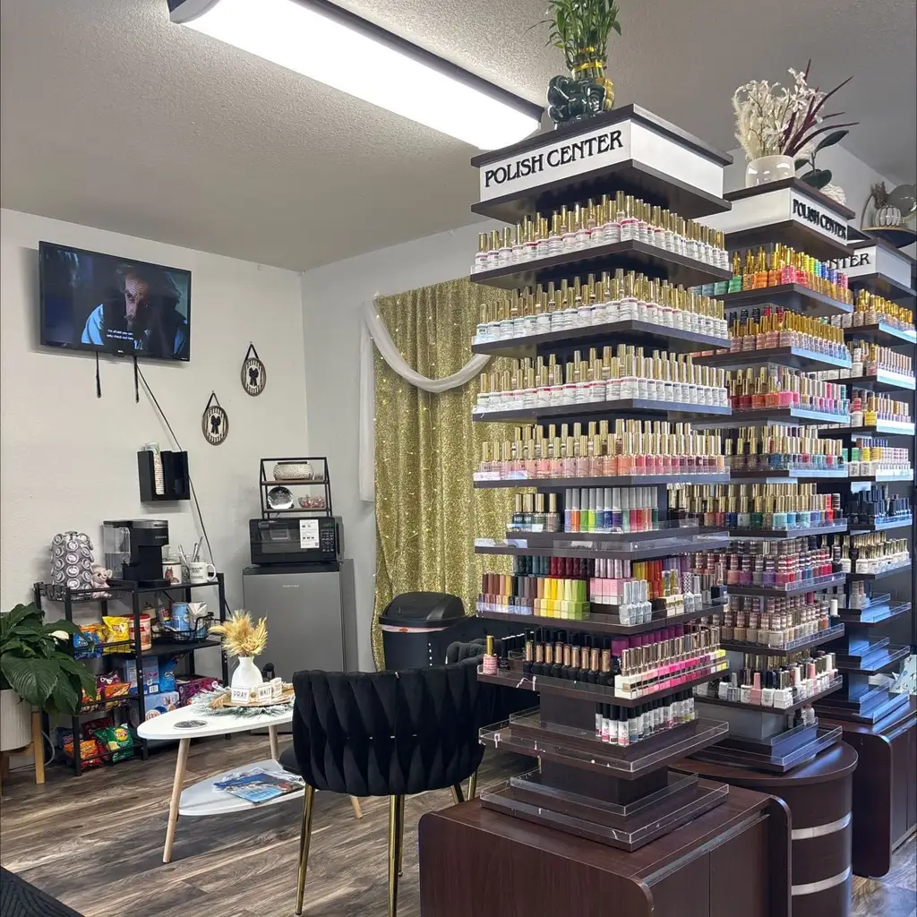 Inside Divine Nails of NoCo: a tall wall of polish colors and the lounge